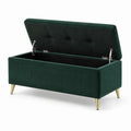 Banc de rangement en velours vert avec pieds en métal doré